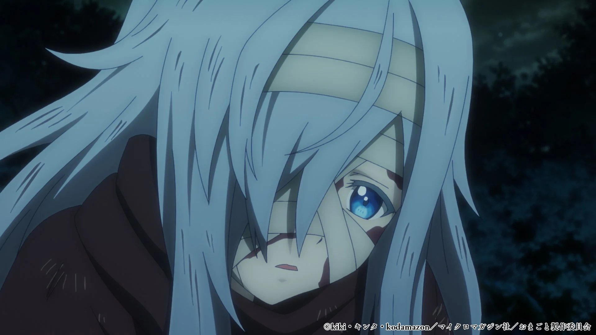 顔に包帯を巻いた悲しげな少女